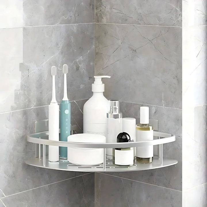 Wall-mounted 1-tier rustproof bathroom organizer shelf, offering modern silver and black decor.