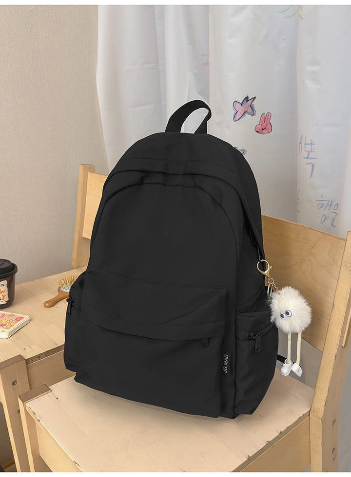 Durable nylon minimalist school backpack, ideal for college students & daily commute. Spacious travel laptop bag.