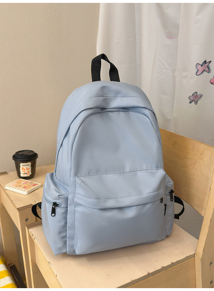 Multi-functional minimalist backpack with laptop sleeve, perfect for college, work, or as a sleek travel bag.