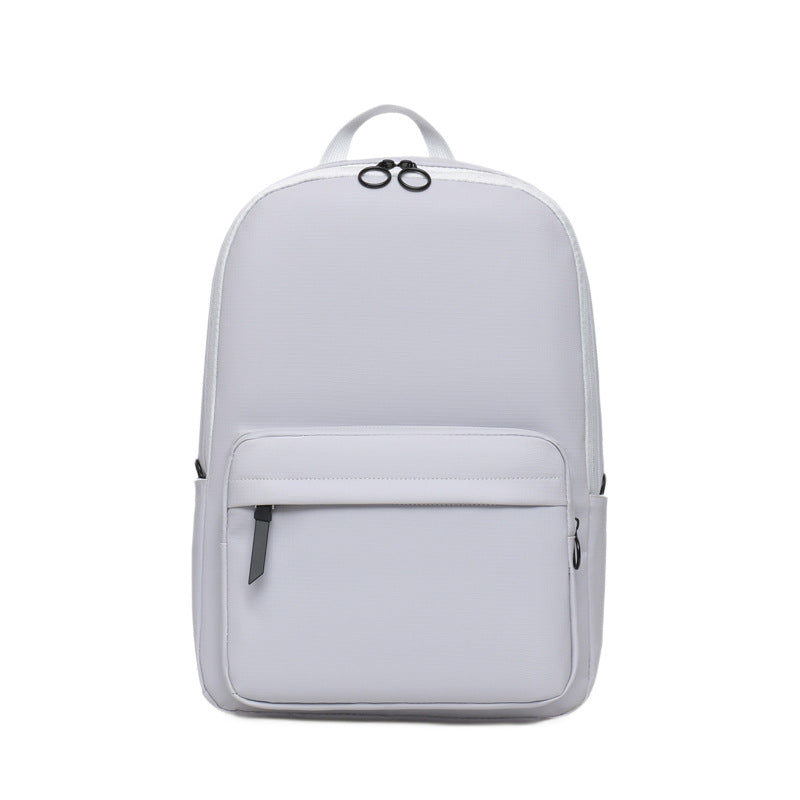 Sleek black textured laptop backpack for 15-inch laptops. Modern, durable, unisex design for travel or work.