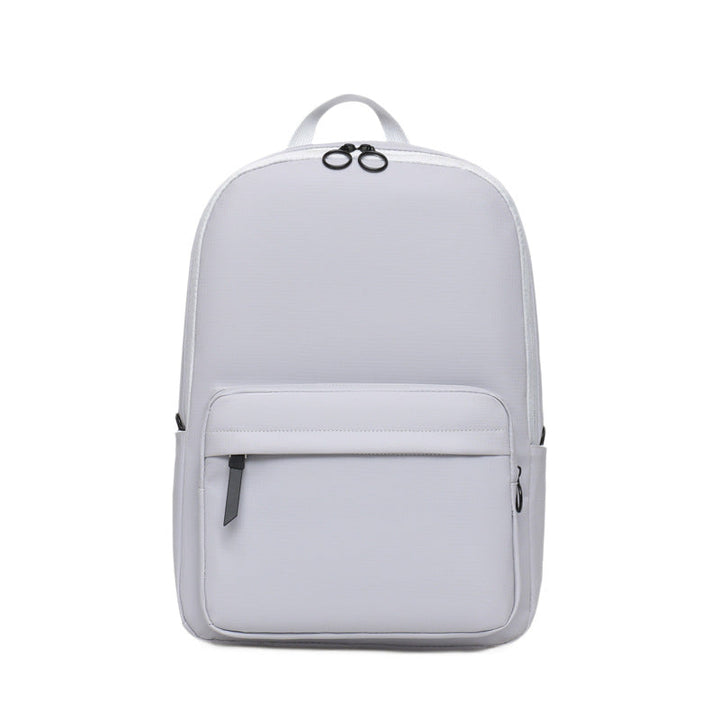 Sleek black textured laptop backpack for 15-inch laptops. Modern, durable, unisex design for travel or work.