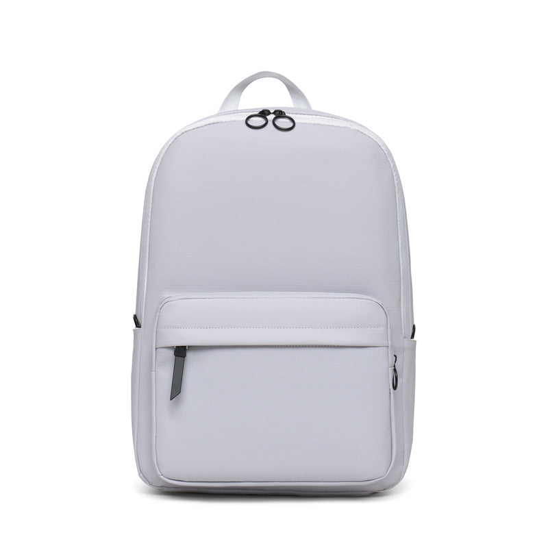 Modern gray textured unisex laptop backpack. Durable school, work, or travel bag for 15-inch laptops.