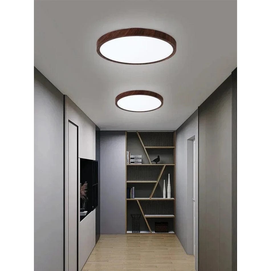 Ultrathin LED ceiling light in log finish; modern circular design, bright home illumination.