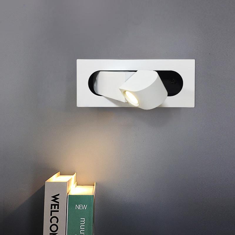 Adjustable LED wall lamp, ideal for modern bedrooms, provides targeted reading light.