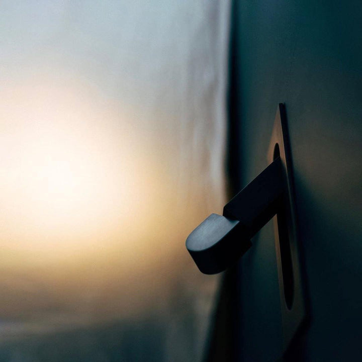 Sleek LED wall light, contemporary, perfect for bedside reading and gentle ambiance.