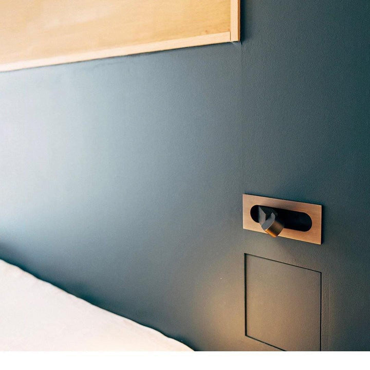 Contemporary LED bedside lamp, sleek design, enhances bedroom functionality & style.