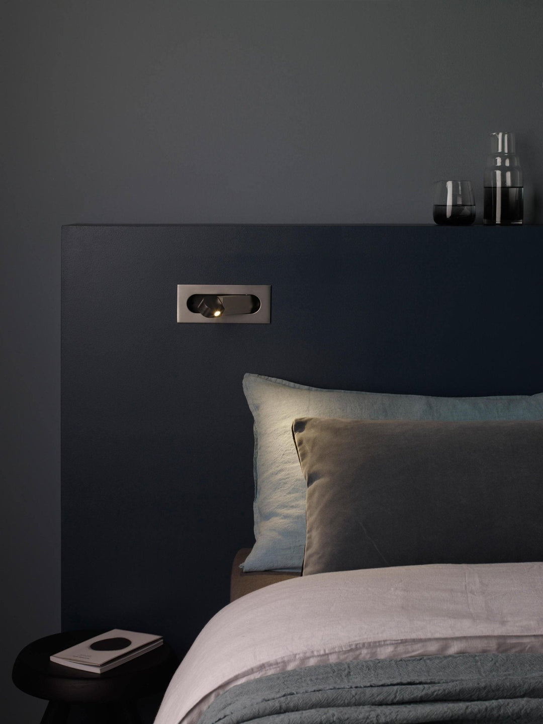 Sleek LED bedside wall light, modern and adjustable, ideal for focused task lighting.