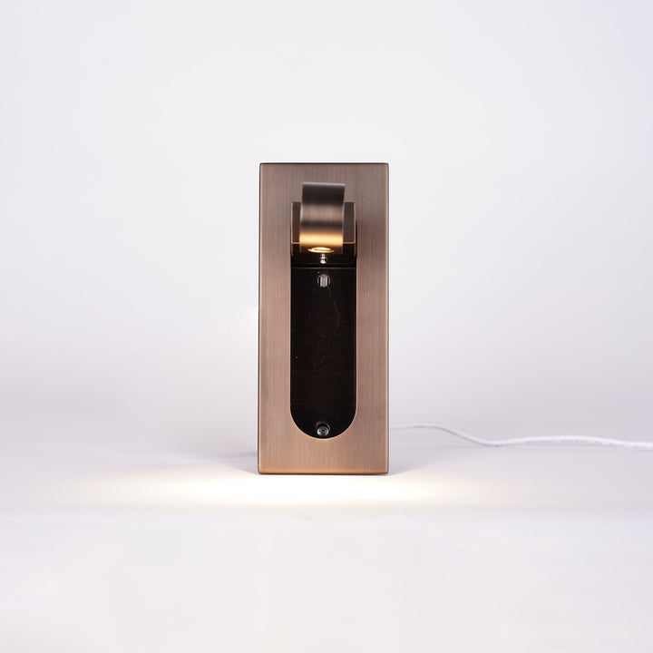 Modern adjustable LED wall lamp, sleek finish, provides bright reading light for beds.