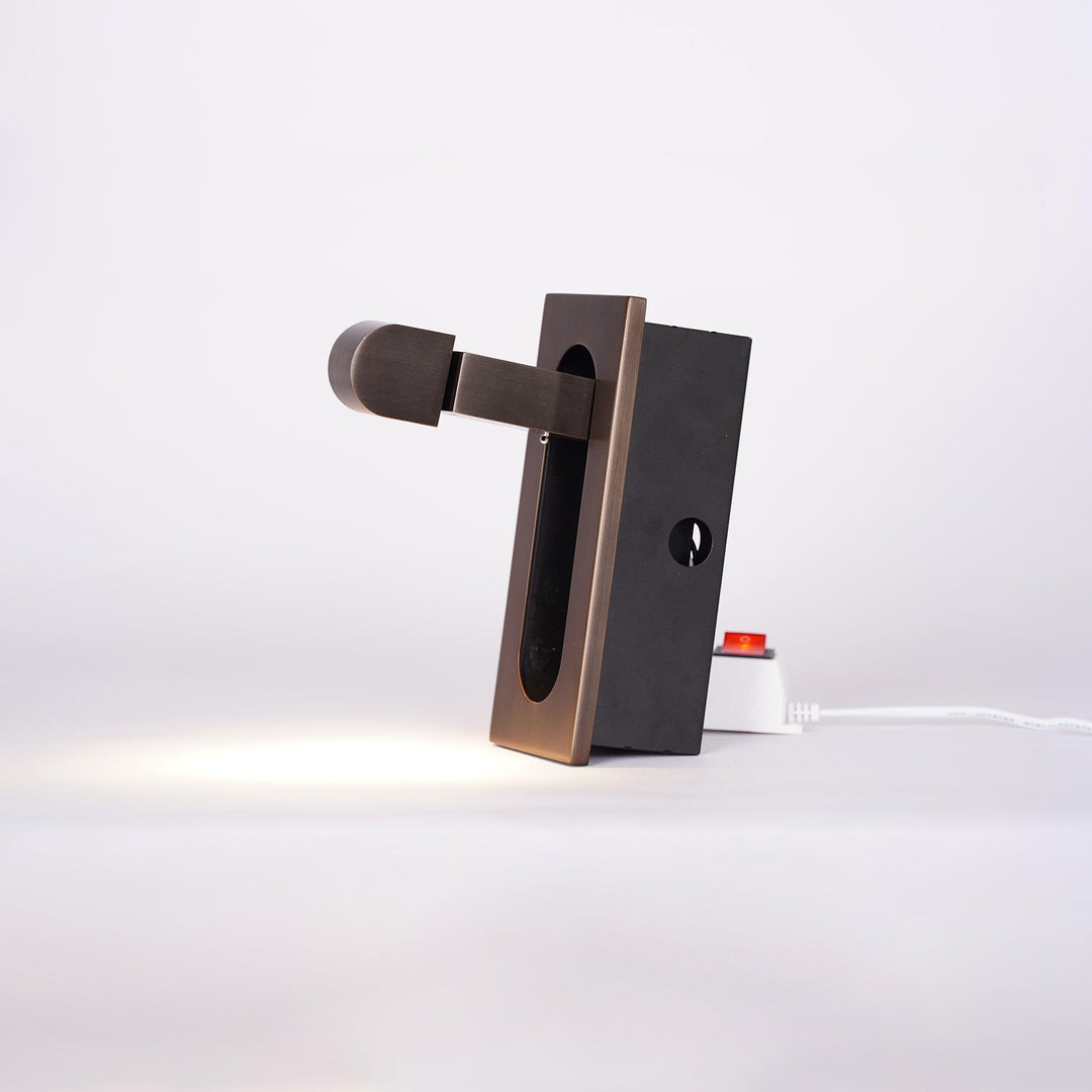 Contemporary LED bedside light, wall-mounted, adjustable for personalized illumination.
