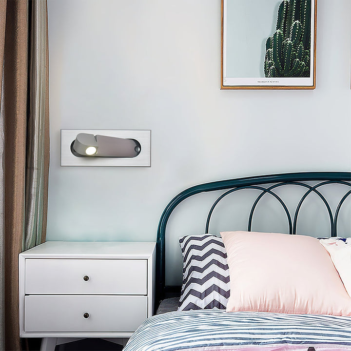 Sleek LED bedside task light, adjustable wall lamp, enhances modern bedroom aesthetic.