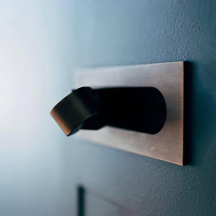 Wall-mounted LED reading lamp, adjustable, contemporary design, great for small spaces.