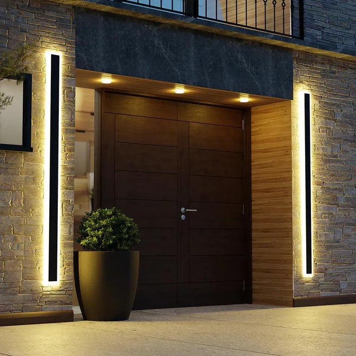 Sleek modern black outdoor LED wall light, perfect for architectural patio & garden illumination. Energy-efficient design.