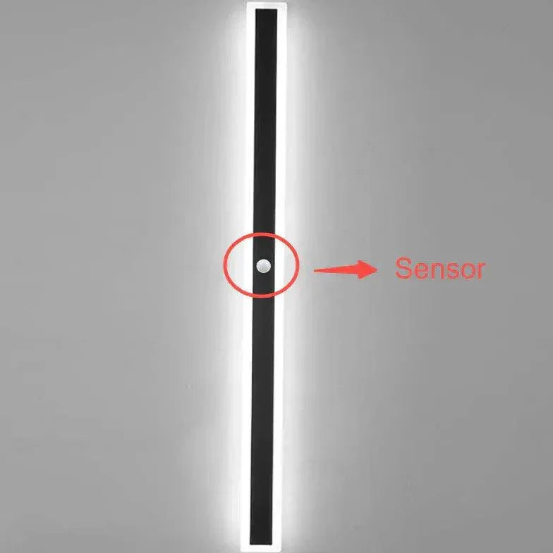 Contemporary black LED wall light, ideal modern exterior decor for garden, patio, or architectural outdoor spaces.