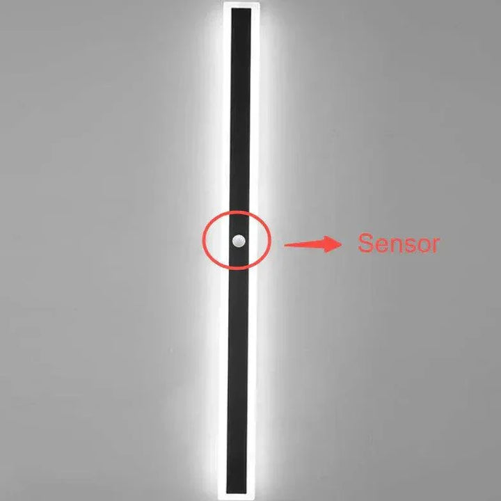 Contemporary black LED wall light, ideal modern exterior decor for garden, patio, or architectural outdoor spaces.
