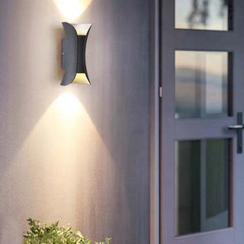 Versatile modern LED outdoor wall light for garden, patio, & entryway home decor.