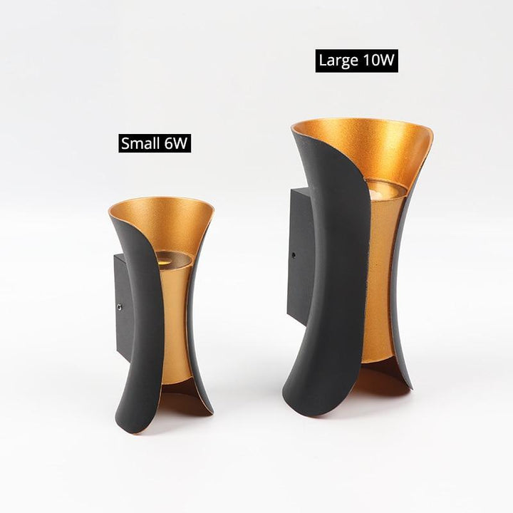 Modern LED outdoor wall light, enhancing safety & style for entryways & patios.