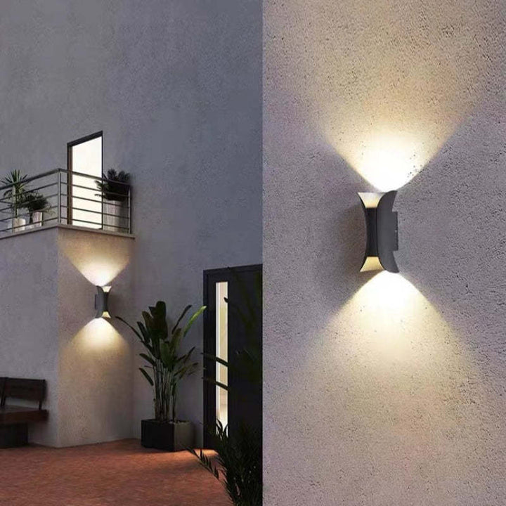 Modern black LED outdoor wall light, energy-efficient & sleek design for home decor.
