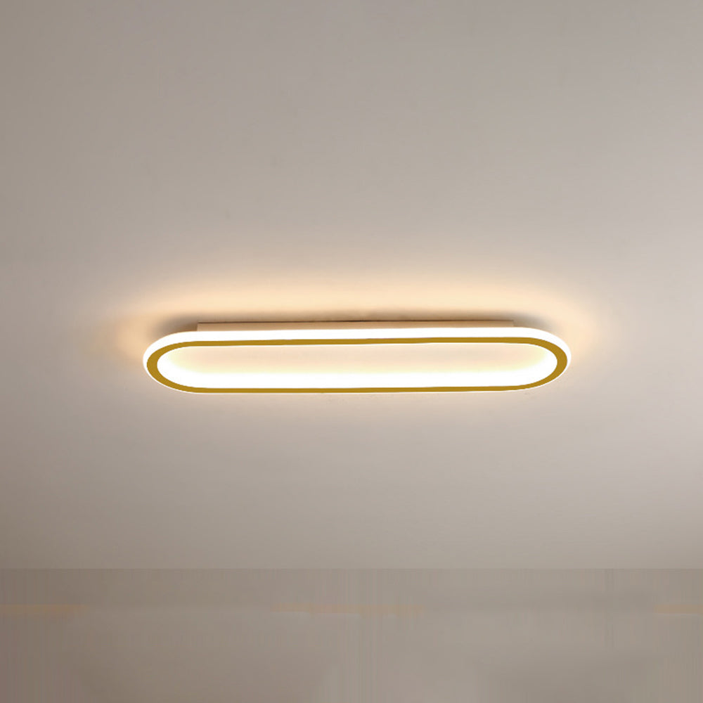 Modern gold oval flush mount LED light, enhancing home illumination beautifully.