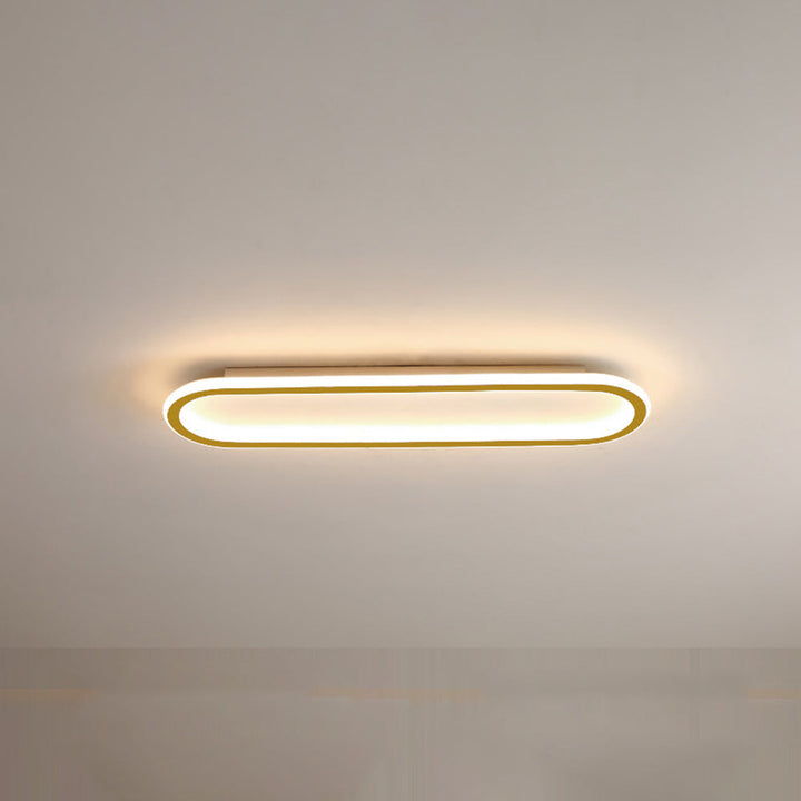 Modern gold oval flush mount LED light, enhancing home illumination beautifully.