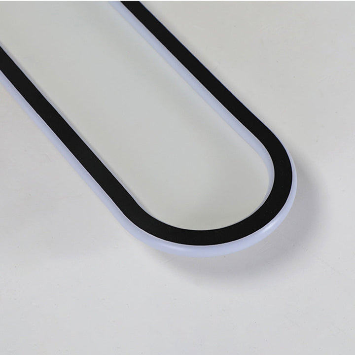 Black finish sleek oval flush mount ceiling light, a minimalist modern decor piece.