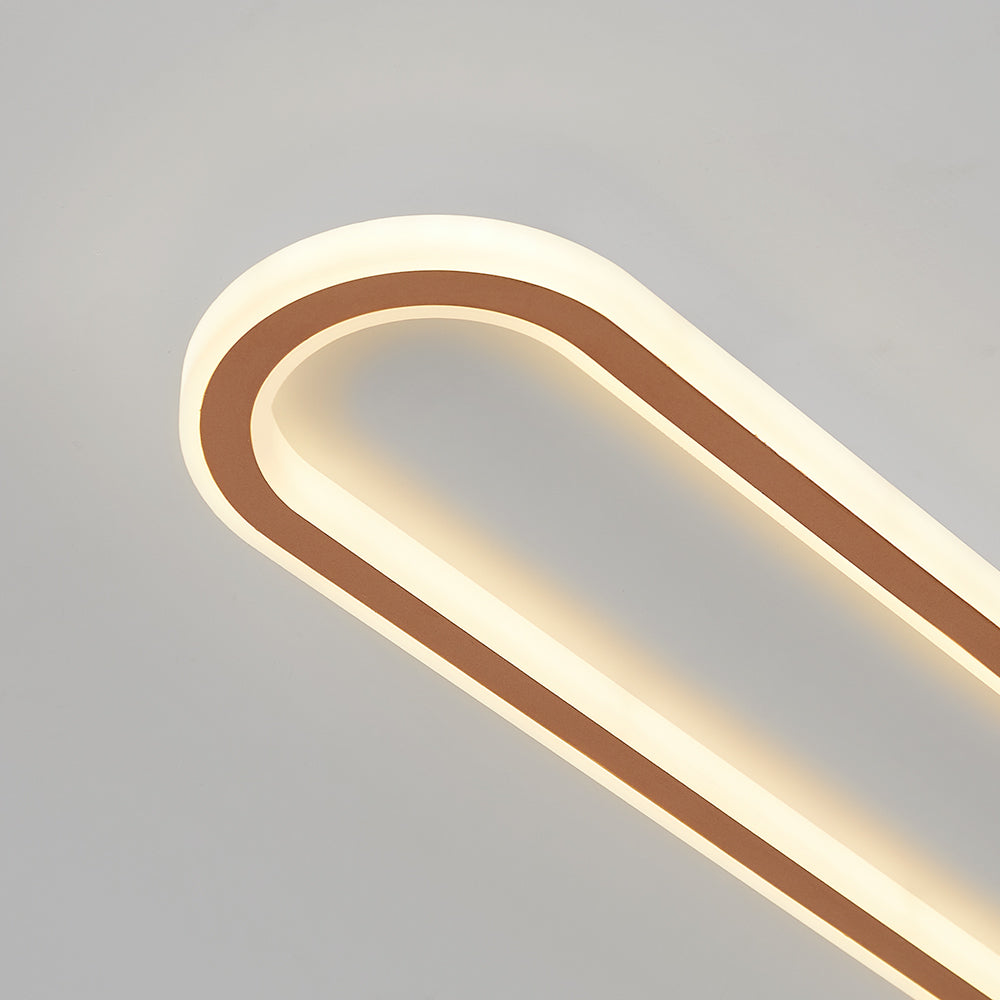 Rose gold oval flush mount LED light for ceilings, ideal for modern home illumination.