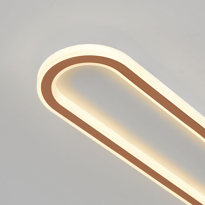 Rose gold oval flush mount LED light for ceilings, ideal for modern home illumination.