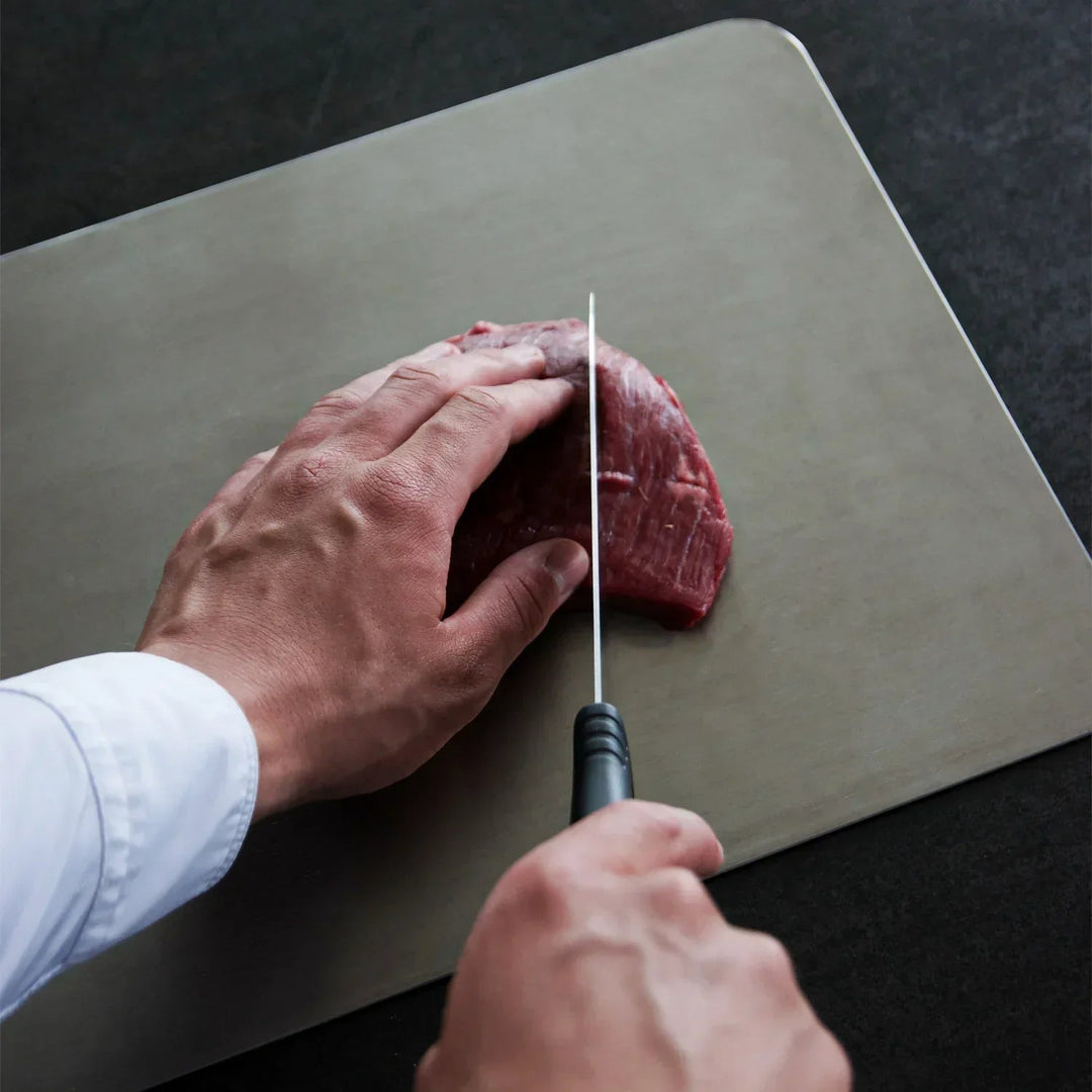 Antibacterial titanium cutting board, ideal for professional kitchen food prep, ensuring hygienic and safe cooking.