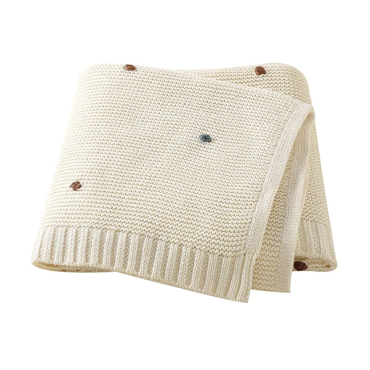 Hand-knitted cotton baby blanket providing ultimate comfort and warmth.