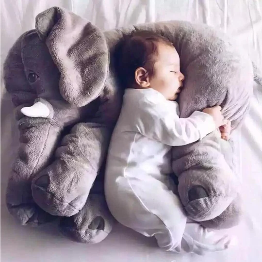 Soft baby elephant plush pillow for snuggle & play. Perfect comfort toy for newborns & toddlers in nursery.