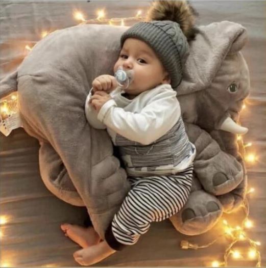 Adorable plush elephant pillow, perfect for baby comfort and playtime.