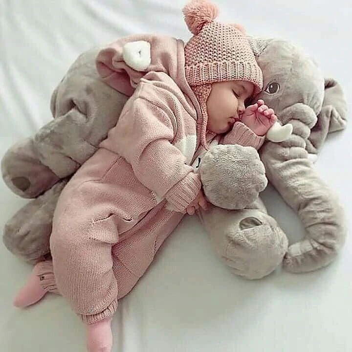 Cute grey elephant baby pillow, a soft and cuddly companion.