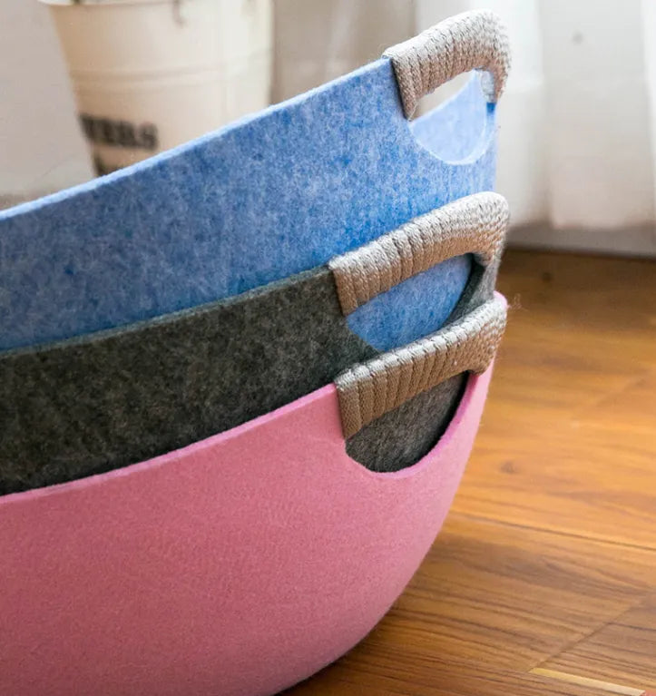 Versatile soft felt pet basket, perfect as a cat bed or toy storage, with integrated carry handles.