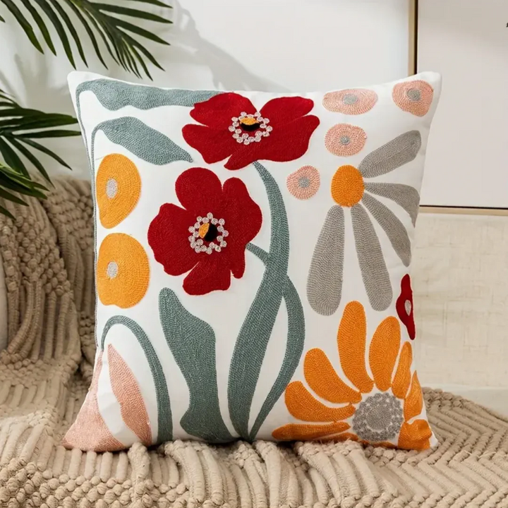 Soft floral throw pillow with delicate flower pattern, perfect as a decorative accent for living room sofas or bedroom.