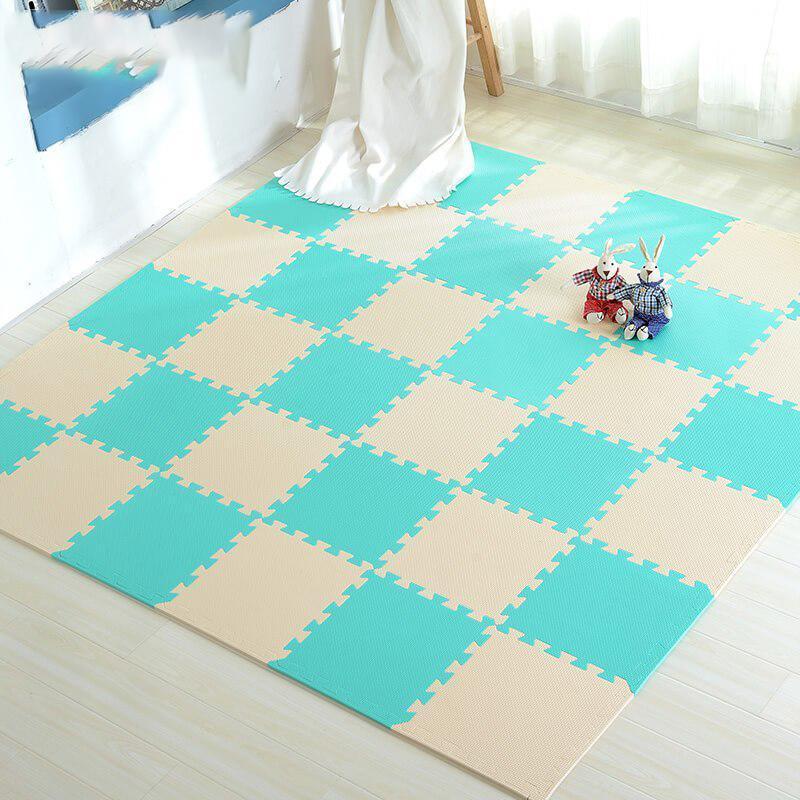 Colorful foam floor tiles create a safe baby play area, perfect for nursery decor.