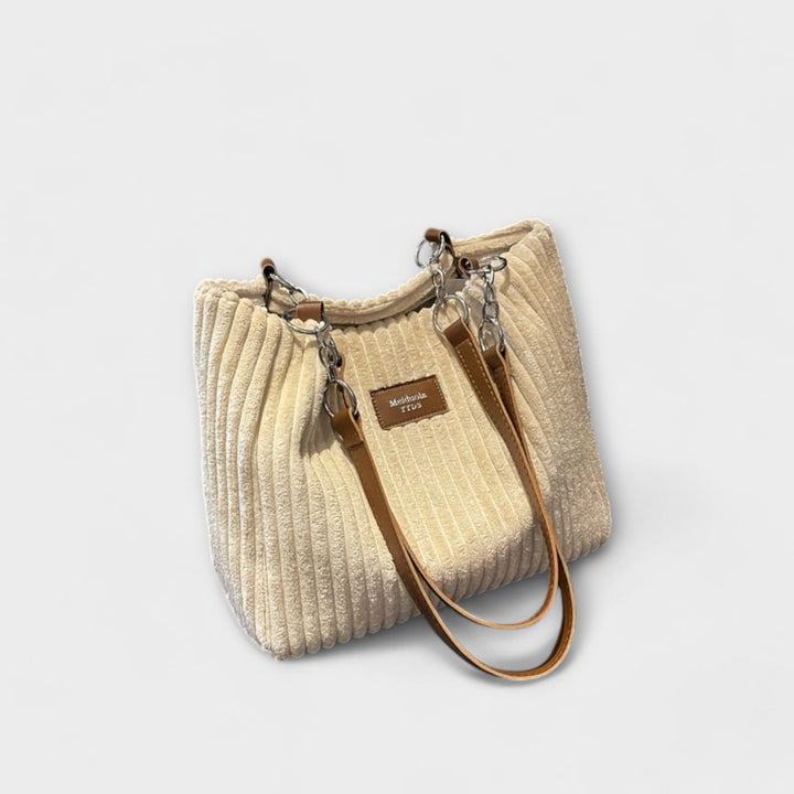 Chic green corduroy shoulder bag, a soft and versatile women's everyday fashion accessory.