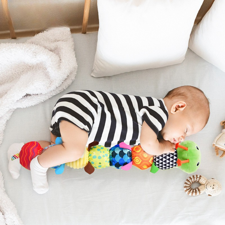 Soft musical caterpillar baby toy with colorful patterns for sensory play