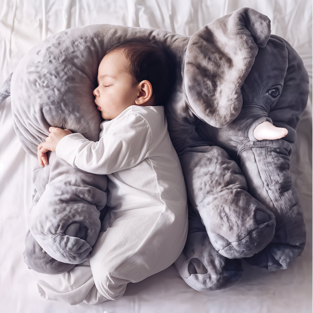 Soft plush elephant pillow for kids, perfect for cuddles and nursery decor.