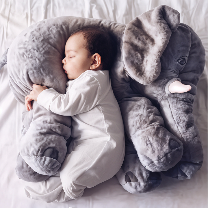Soft plush elephant pillow for kids, perfect for cuddles and nursery decor.