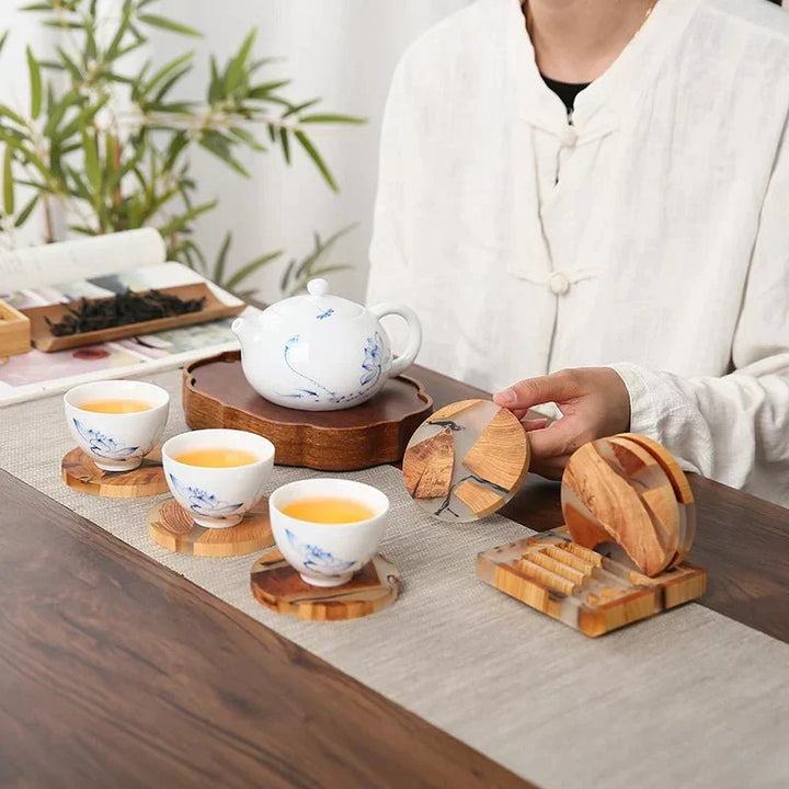 Handcrafted solid wood coasters with intricate Japanese design & modern resin accent for stylish home decor.
