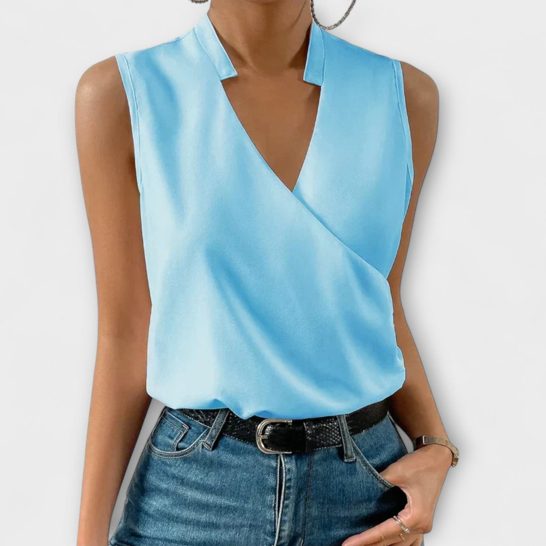 Elegant women's V-neck blouse, offering versatile style from casual day to chic evening looks.