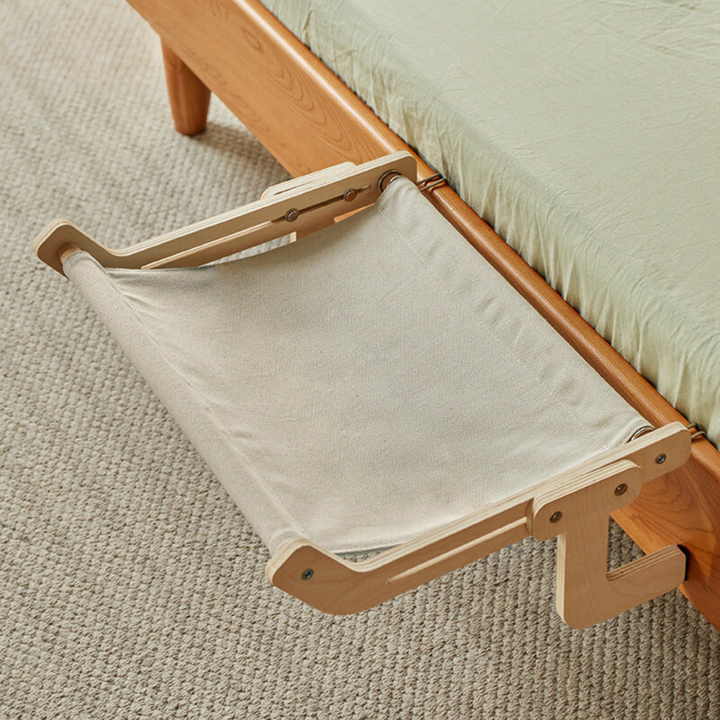 Versatile cat hammock functions as a space-saving pet bed, attaching discreetly under furniture.
