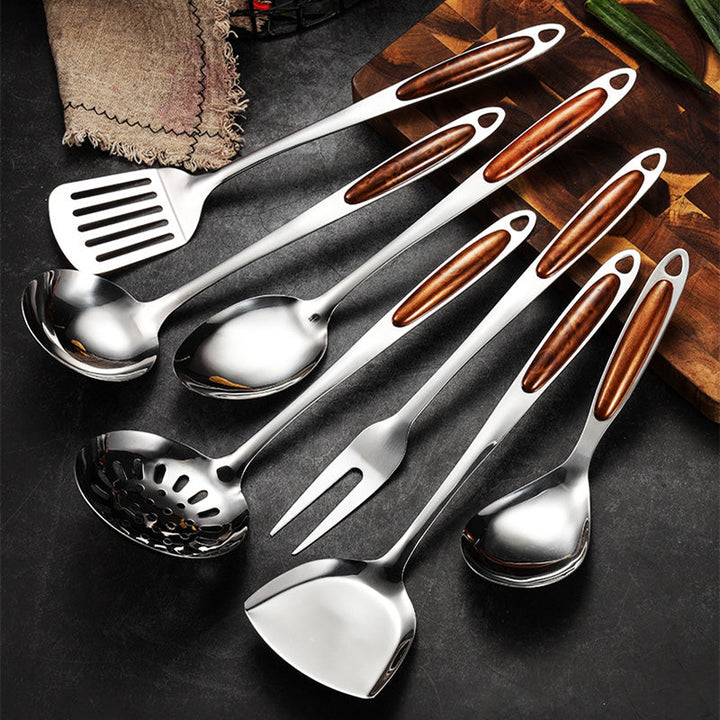 Durable stainless steel cooking utensil set. Ergonomic wooden handles for comfortable grip. Essential kitchenware for chefs.