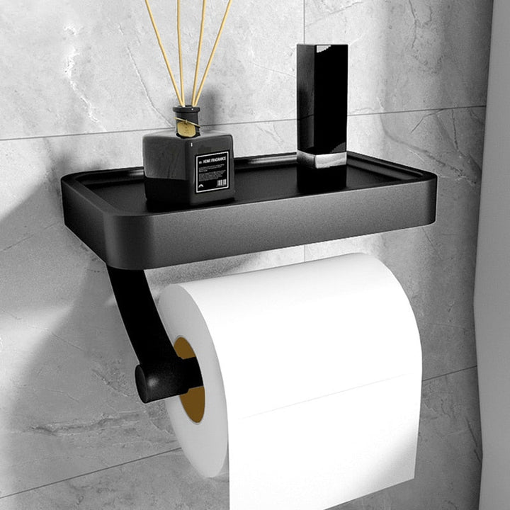 Stainless steel toilet paper holder with convenient storage shelf for bathroom organization.
