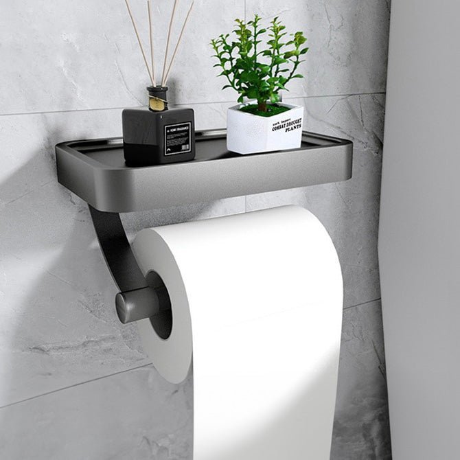 Stylish black stainless steel toilet paper holder with a functional storage shelf.