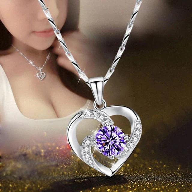 Elegant sterling silver necklace featuring a romantic heart pendant adorned with CZ crystals.