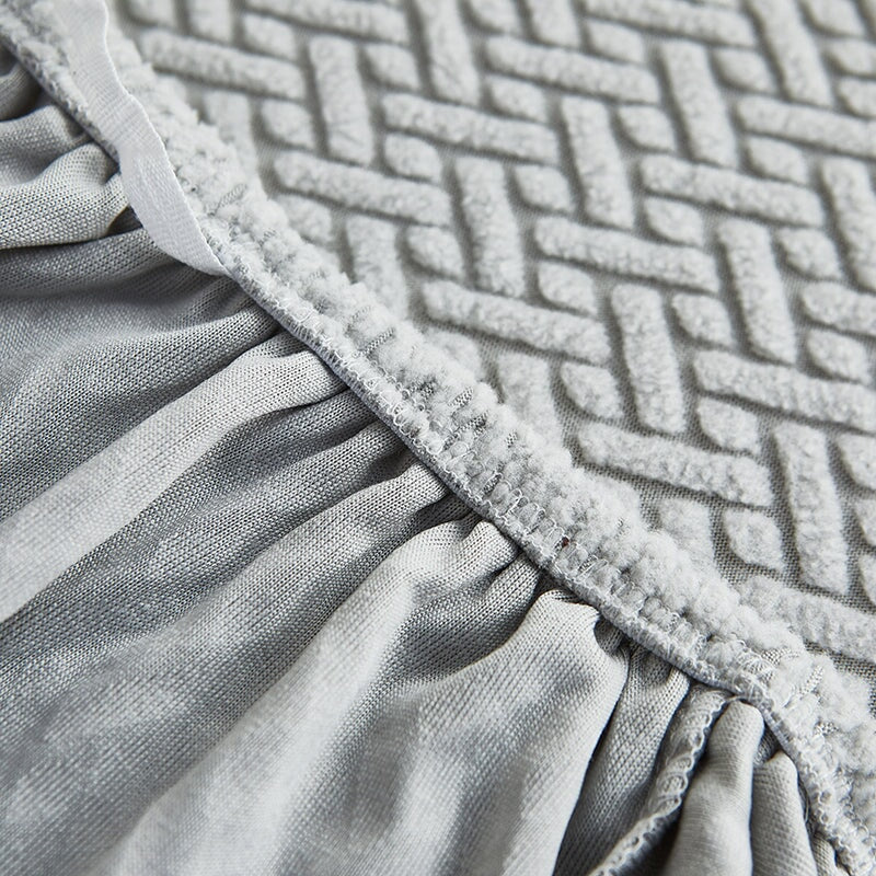 Stretchable sectional sofa protector, preventing stains, wear, and pet damage.