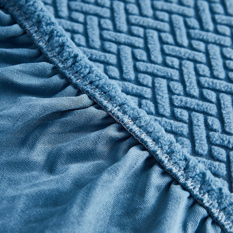 Cream stretchable furniture cover for sectional sofas, offering protection & a fresh look.