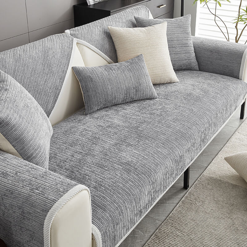Modern striped chenille sofa cover, stylish pet-friendly living room furniture protector.