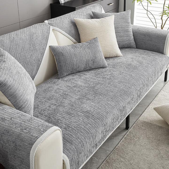 Modern striped chenille sofa cover, stylish pet-friendly living room furniture protector.