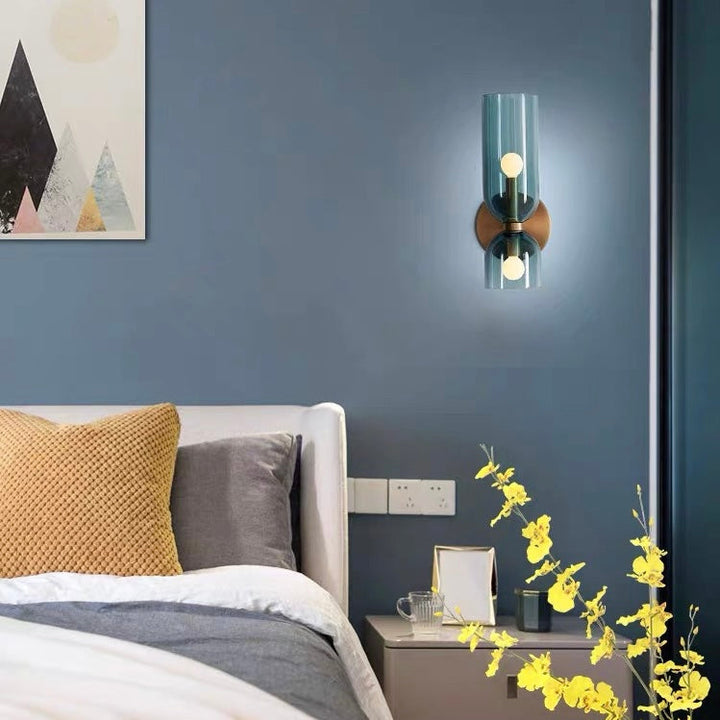 Chic glass twin wall lamp, features dual shades for a sophisticated, modern lighting look.